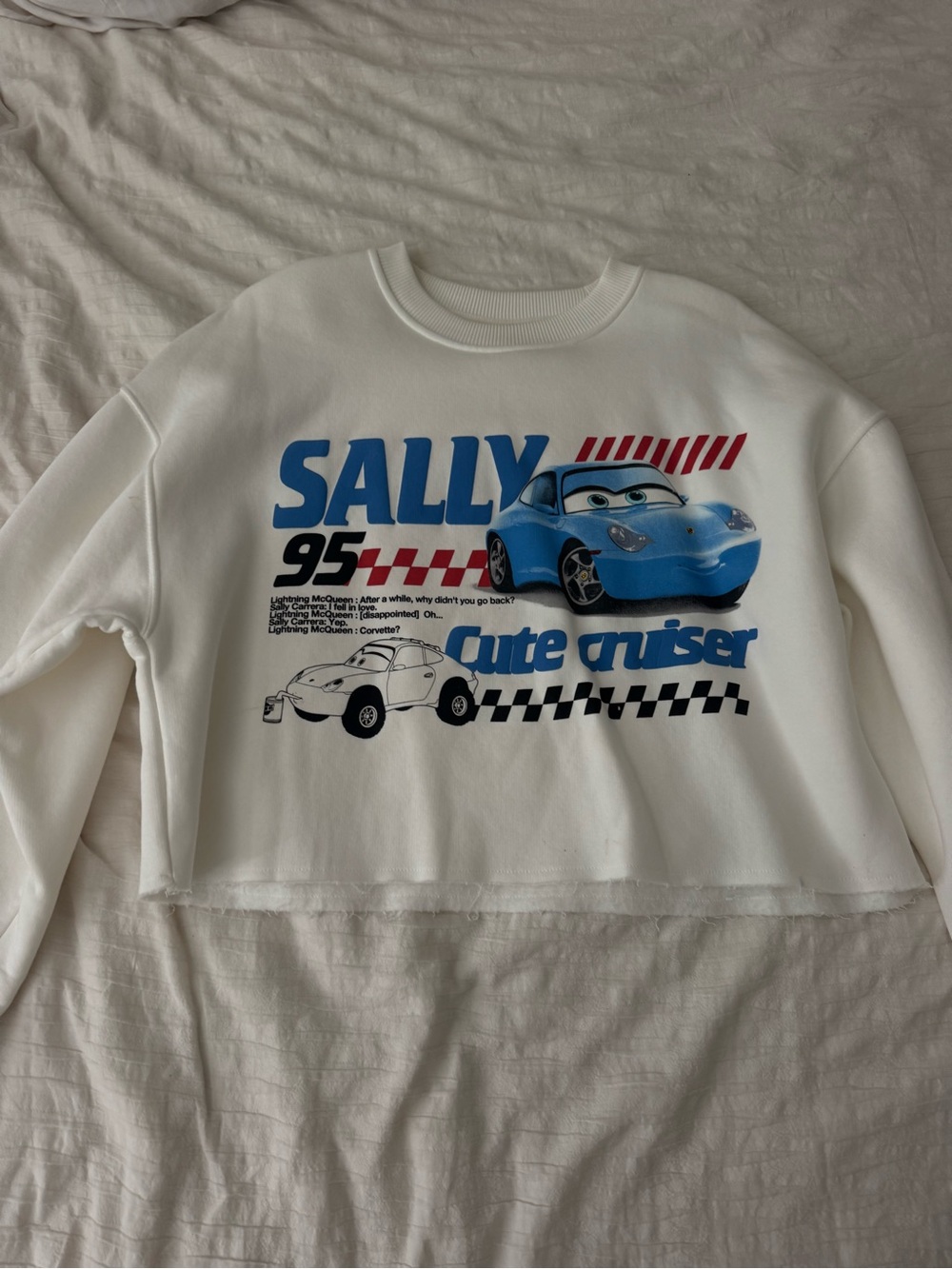 Disney Cropped White Sweatshirt with Blue 'Sally' Cars Graphic
